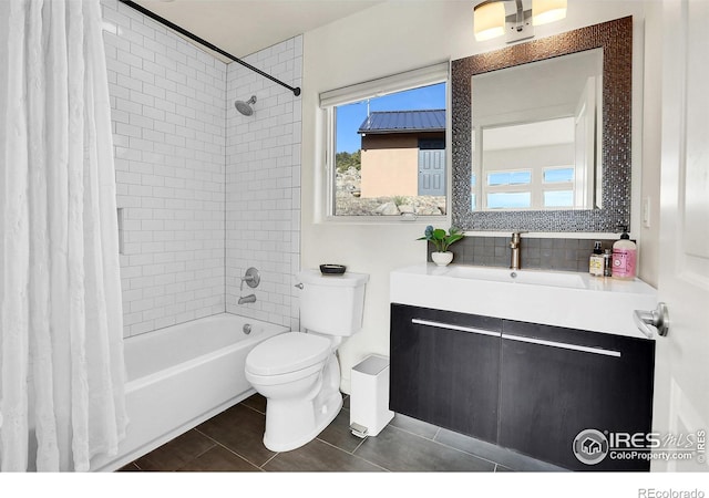 bathroom with toilet, tile patterned flooring, shower / bath combo, and vanity