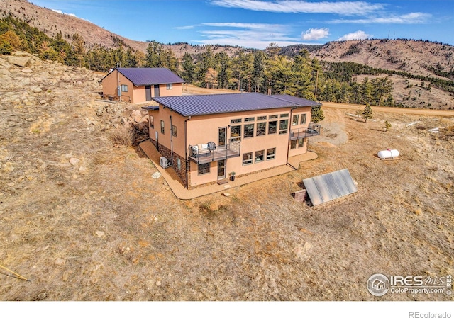 drone / aerial view featuring a mountain view