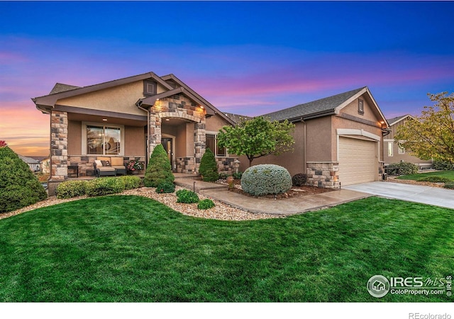 craftsman inspired home with an attached garage, stone siding, concrete driveway, stucco siding, and a front yard