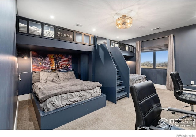 bedroom featuring carpet floors, visible vents, and baseboards