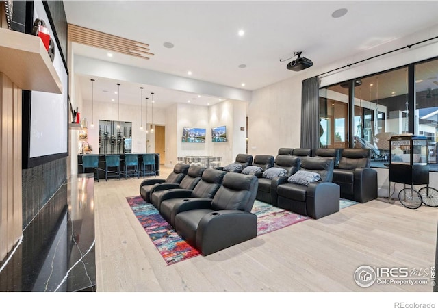 home theater featuring recessed lighting and wood finished floors