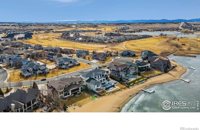 aerial view with a water view and a residential view