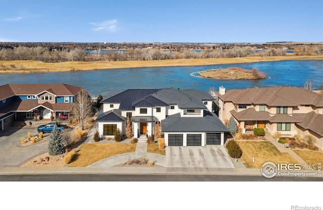 birds eye view of property with a water view and a residential view