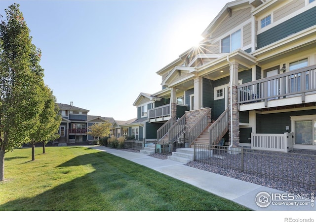 view of home's community with a residential view and a yard