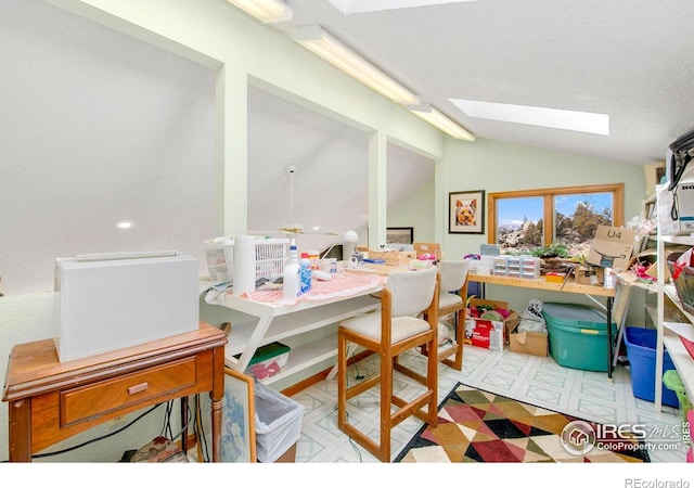 recreation room featuring lofted ceiling with skylight and tile patterned floors