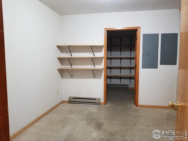 interior space featuring a baseboard heating unit, a baseboard radiator, and electric panel