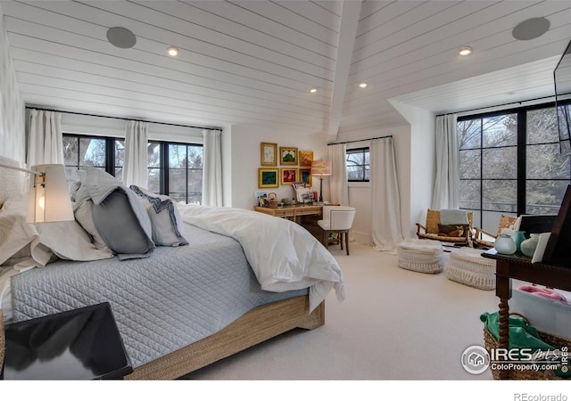 bedroom featuring recessed lighting, carpet flooring, and multiple windows