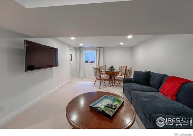 living area with baseboards, carpet, and recessed lighting