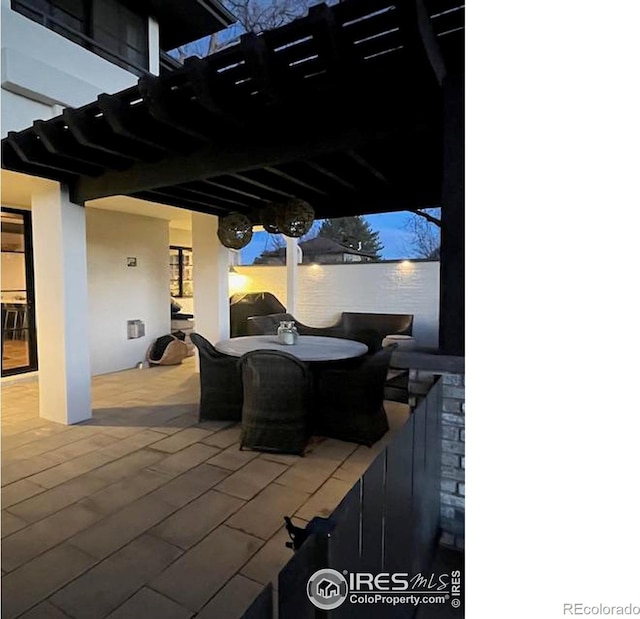 view of patio / terrace featuring outdoor dining area and a pergola