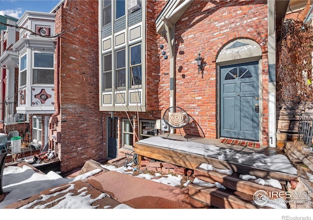 entrance to property with brick siding