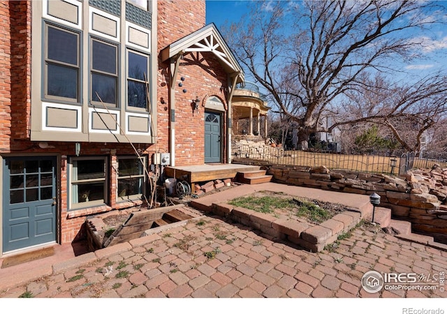 view of patio / terrace featuring fence