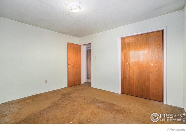 unfurnished bedroom featuring carpet flooring