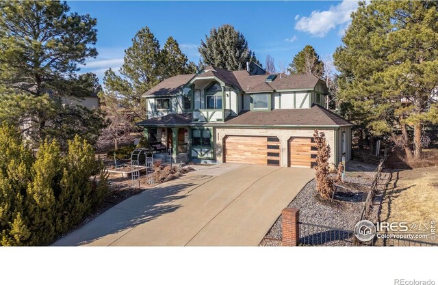 view of front of property featuring a garage and concrete driveway