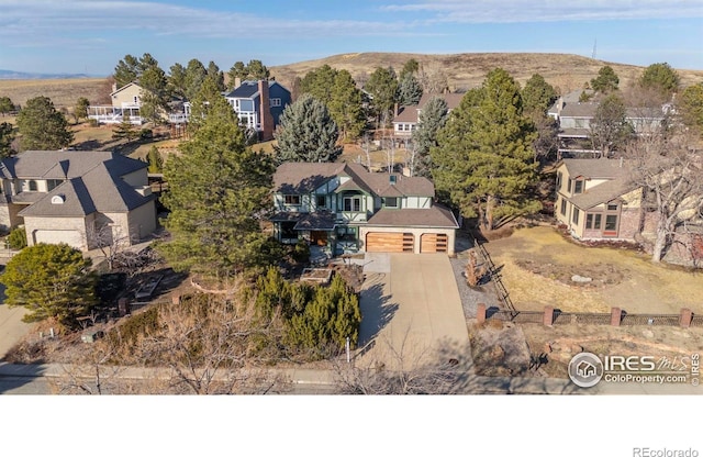 birds eye view of property featuring a residential view and a mountain view