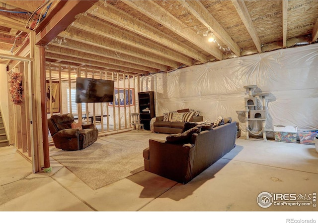 living room with concrete flooring