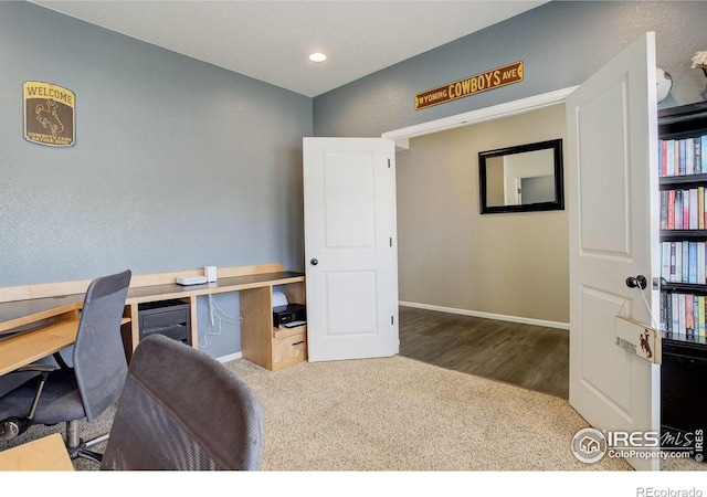 home office featuring baseboards, wood finished floors, and recessed lighting