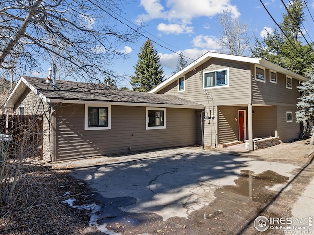 view of front of home with aphalt driveway