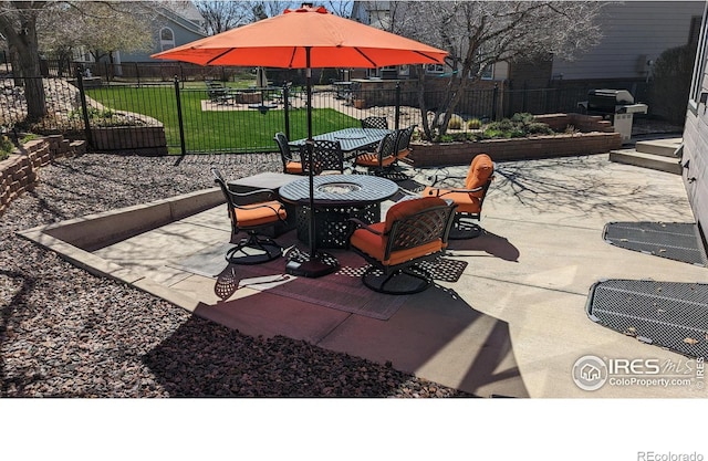 view of patio / terrace with outdoor dining area, area for grilling, and fence