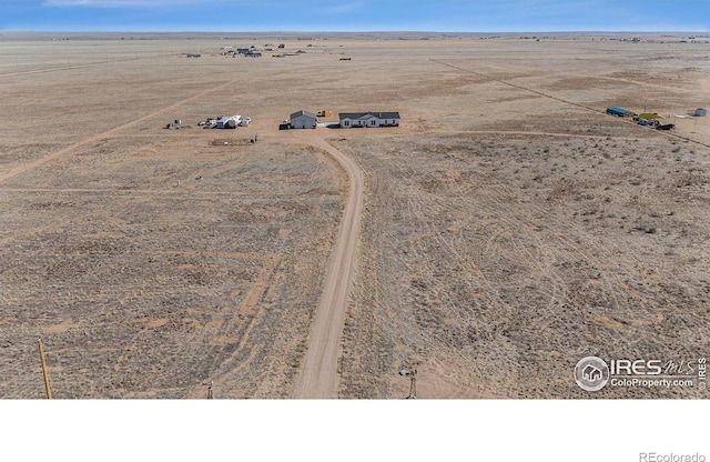 bird's eye view featuring view of desert and a rural view