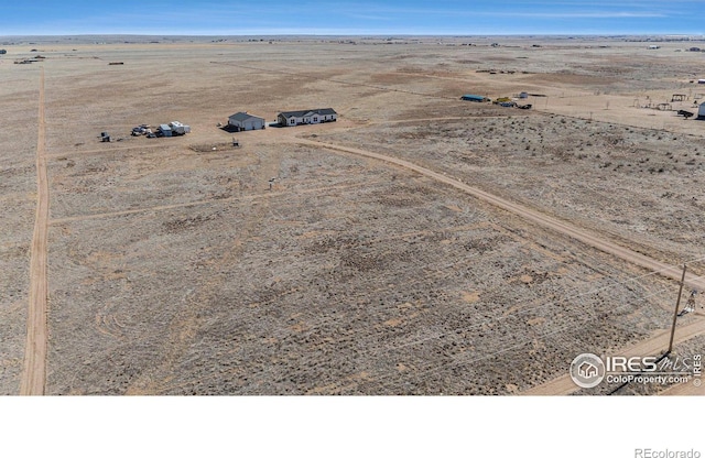 aerial view featuring a rural view and a desert view