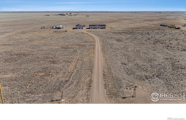 bird's eye view featuring a desert view and a rural view