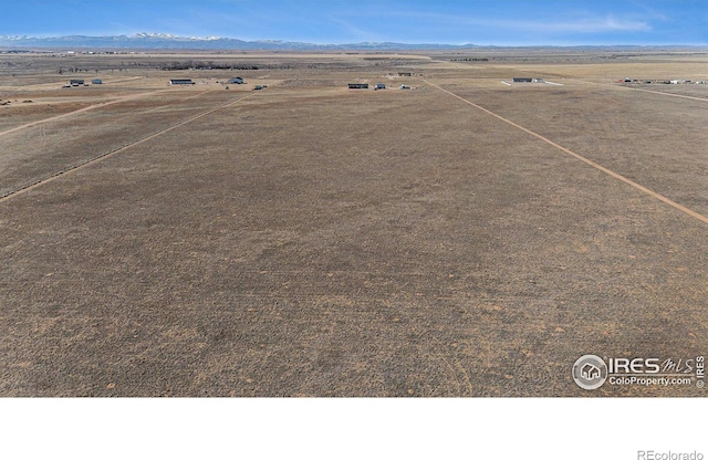 birds eye view of property with a rural view and a mountain view