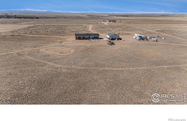 birds eye view of property featuring a rural view