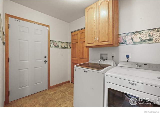 laundry room featuring cabinet space and independent washer and dryer