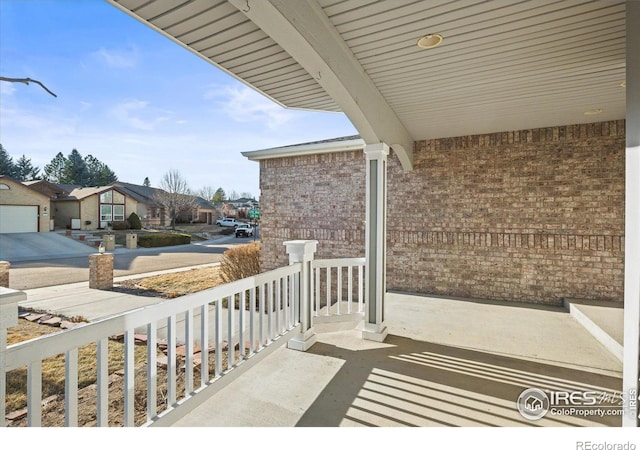 balcony featuring a porch and a residential view