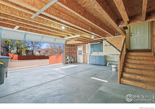 interior space featuring a garage and stairs