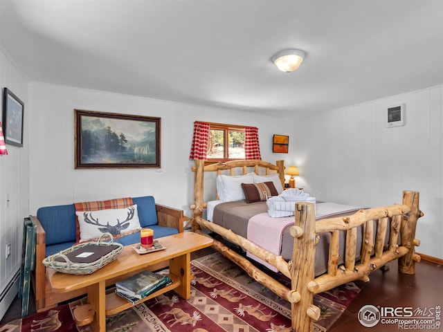 bedroom with wood finished floors