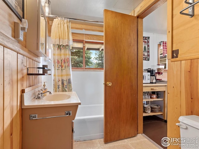 bathroom featuring a tub, curtained shower, vanity, and toilet