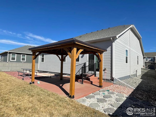 exterior space with fence and a gazebo