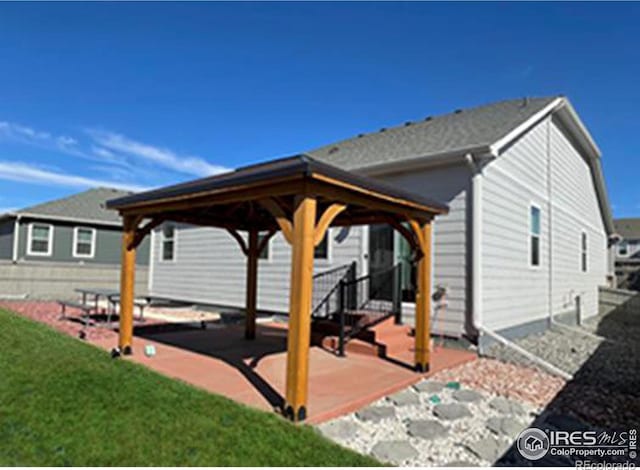 1431 Vantage Pkwy, Berthoud, CO 80513 - back of property with a gazebo, a patio area, and a yard