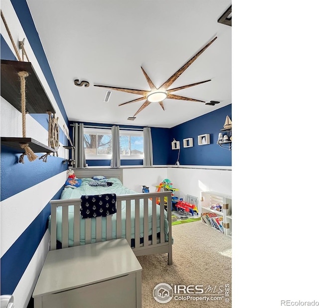 carpeted bedroom featuring a ceiling fan