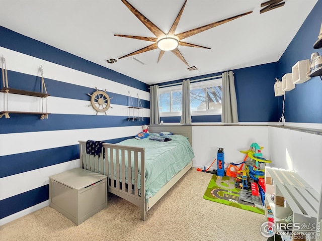 bedroom with a ceiling fan and baseboards