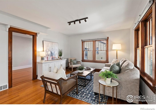 530 Laporte Ave, Fort Collins, CO 80521 - living area featuring rail lighting, visible vents, baseboards, and wood finished floors