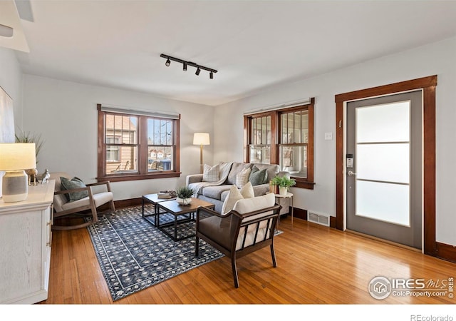 530 Laporte Ave, Fort Collins, CO 80521 - living room with track lighting, light wood-type flooring, baseboards, and visible vents