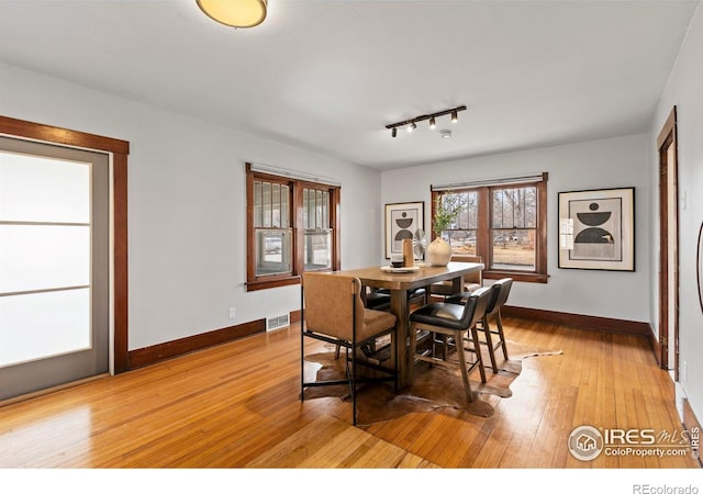 530 Laporte Ave, Fort Collins, CO 80521 - dining space with visible vents, light wood-type flooring, and baseboards