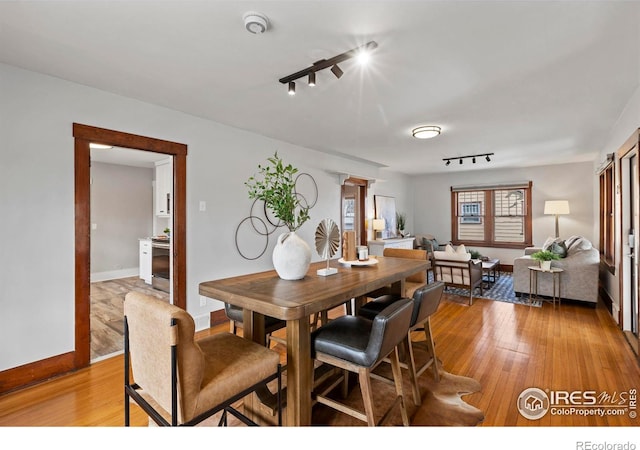 530 Laporte Ave, Fort Collins, CO 80521 - dining room featuring light wood-style flooring, baseboards, and track lighting