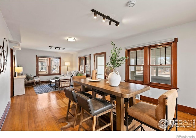 530 Laporte Ave, Fort Collins, CO 80521 - dining space with light wood-type flooring, baseboards, and track lighting