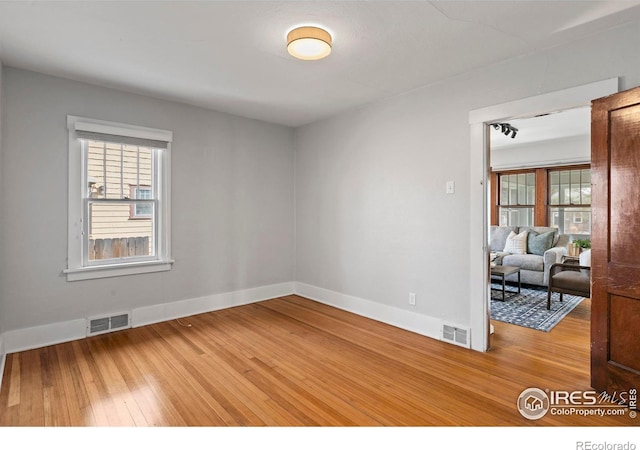 530 Laporte Ave, Fort Collins, CO 80521 - unfurnished room with visible vents, hardwood / wood-style flooring, and baseboards