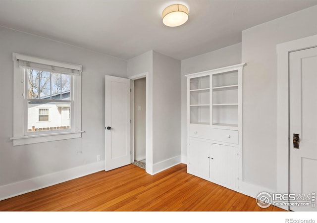 530 Laporte Ave, Fort Collins, CO 80521 - unfurnished bedroom with baseboards and light wood finished floors