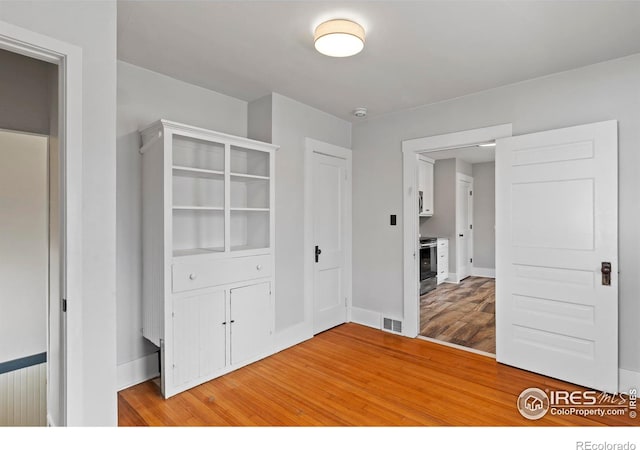 530 Laporte Ave, Fort Collins, CO 80521 - interior space featuring light wood-style flooring, baseboards, and visible vents