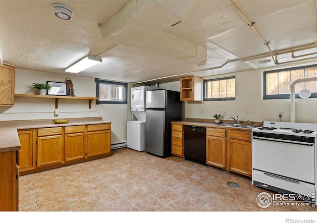 530 Laporte Ave, Fort Collins, CO 80521 - kitchen featuring freestanding refrigerator, white gas stove, open shelves, stacked washer / dryer, and black dishwasher