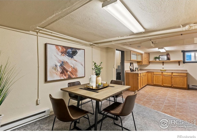 530 Laporte Ave, Fort Collins, CO 80521 - dining room featuring a baseboard heating unit, a textured ceiling, and light tile patterned flooring