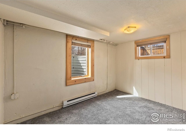 530 Laporte Ave, Fort Collins, CO 80521 - below grade area featuring a textured ceiling, carpet, and baseboard heating