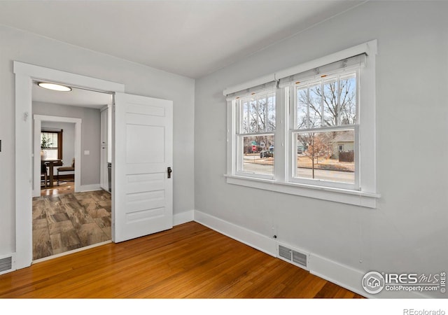 530 Laporte Ave, Fort Collins, CO 80521 - unfurnished room with wood finished floors, baseboards, and visible vents