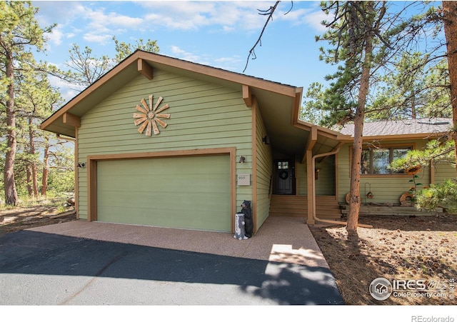 view of front of property featuring driveway and an attached garage