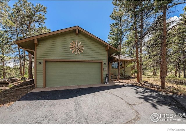 chalet / cabin with an attached garage